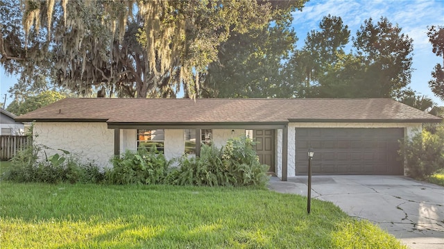 ranch-style house with a front lawn and a garage