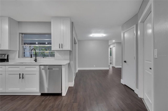 kitchen featuring decorative backsplash, stainless steel dishwasher, dark hardwood / wood-style floors, white cabinets, and sink