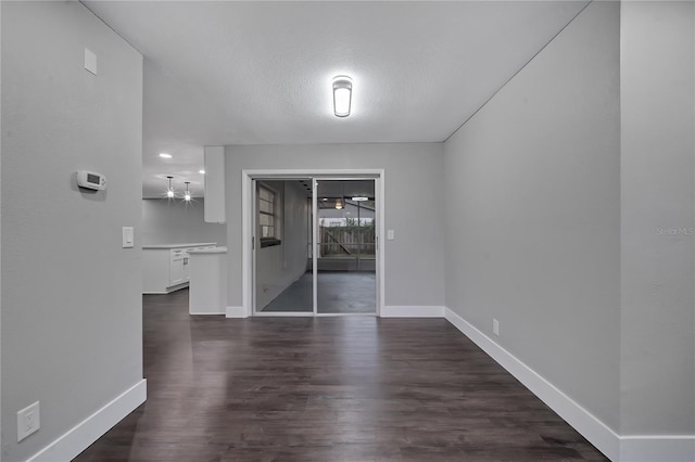 spare room with hardwood / wood-style floors and a textured ceiling