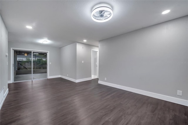 empty room with dark wood-type flooring