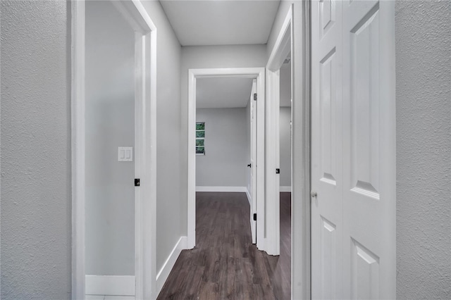 corridor featuring hardwood / wood-style floors