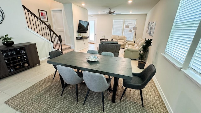 dining room featuring recessed lighting, light tile patterned flooring, ceiling fan, baseboards, and stairs