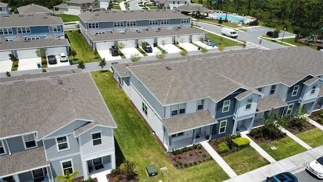 birds eye view of property with a residential view