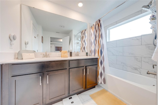 bathroom featuring a sink, marble finish floor, double vanity, and shower / bath combo with shower curtain