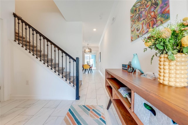 foyer with recessed lighting, baseboards, marble finish floor, ornamental molding, and stairway