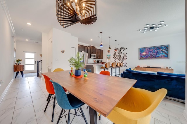 dining room with recessed lighting, marble finish floor, and baseboards