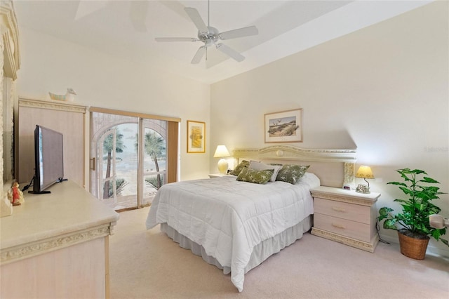 carpeted bedroom with ceiling fan and access to exterior