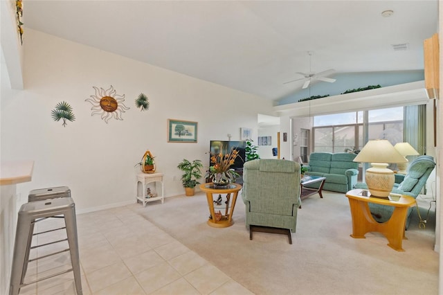 tiled living room featuring ceiling fan and lofted ceiling