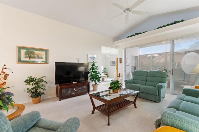 living room with ceiling fan, light carpet, and lofted ceiling