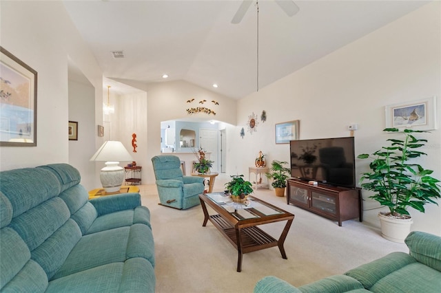 carpeted living room featuring ceiling fan and lofted ceiling