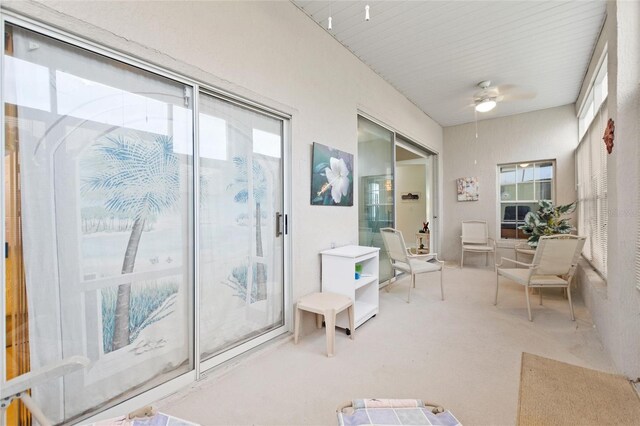 sunroom featuring ceiling fan