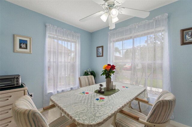 dining area featuring ceiling fan