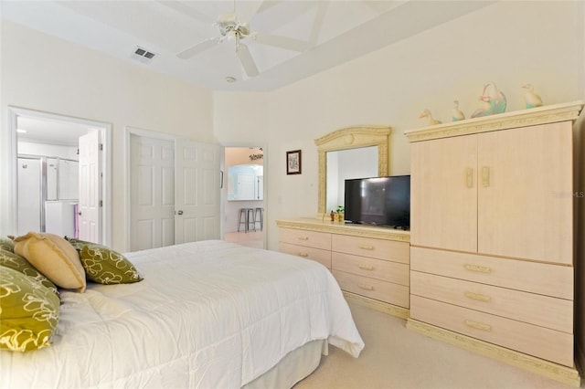 bedroom featuring ceiling fan and light carpet