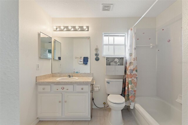 full bathroom featuring tile patterned floors, a textured ceiling, vanity, toilet, and shower / bathtub combination with curtain