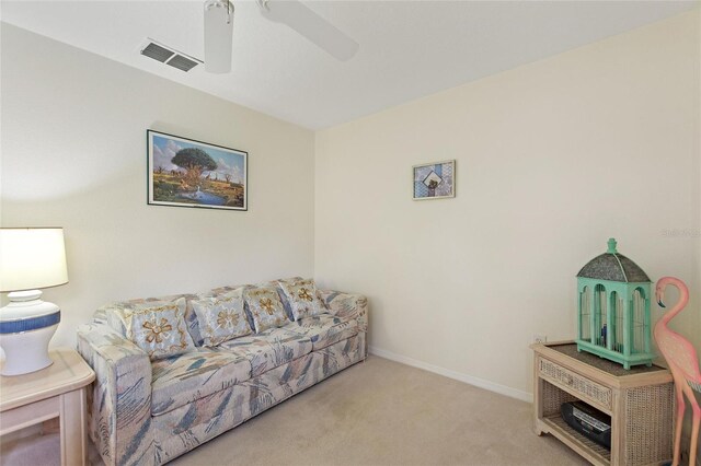 living room featuring ceiling fan and light colored carpet