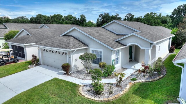 ranch-style home featuring a front yard and a garage