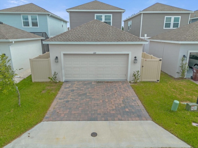 front of property featuring a garage and a front yard