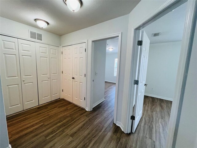 hallway featuring dark hardwood / wood-style flooring