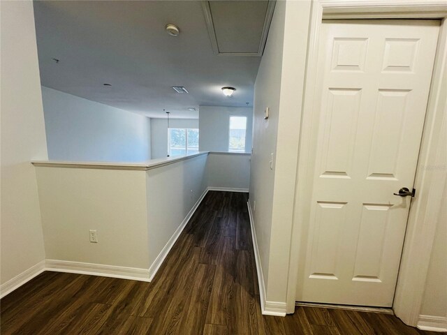 corridor featuring dark hardwood / wood-style floors