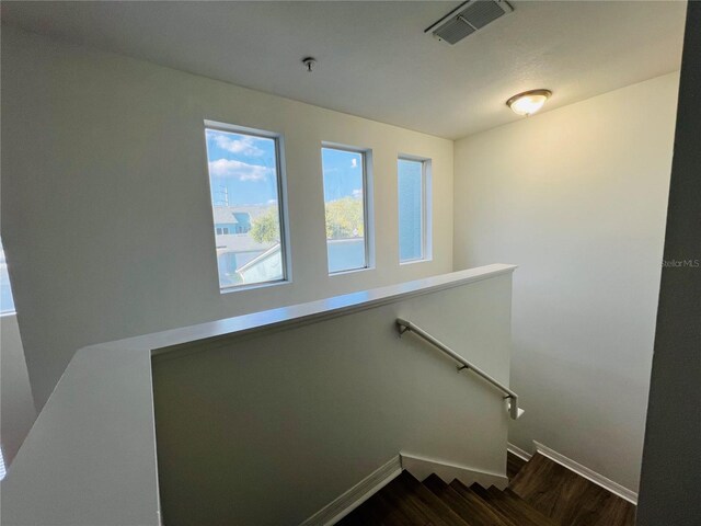 stairs with hardwood / wood-style flooring