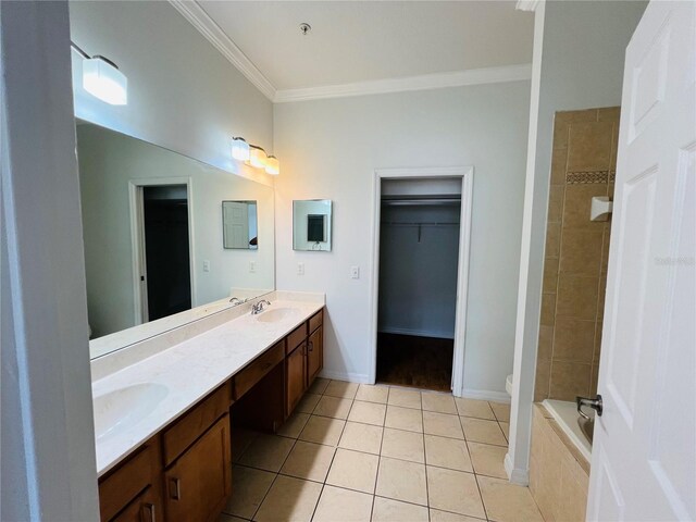 full bathroom with tile patterned flooring, crown molding, double sink vanity, toilet, and tiled shower / bath combo