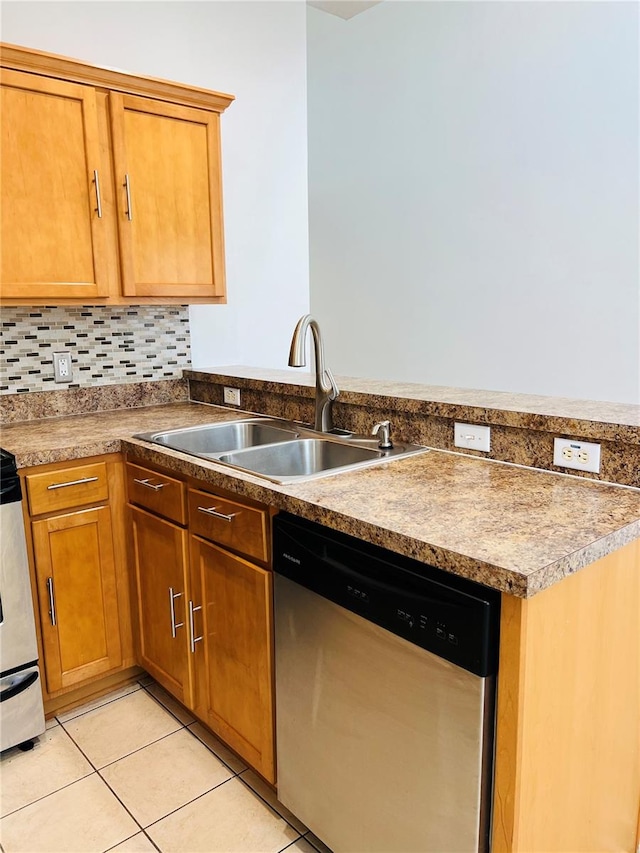 kitchen featuring light tile patterned flooring, sink, stainless steel appliances, and tasteful backsplash