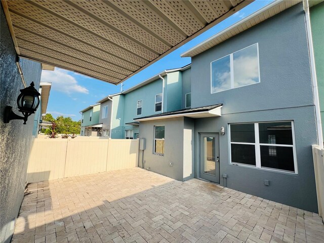 rear view of property with a patio