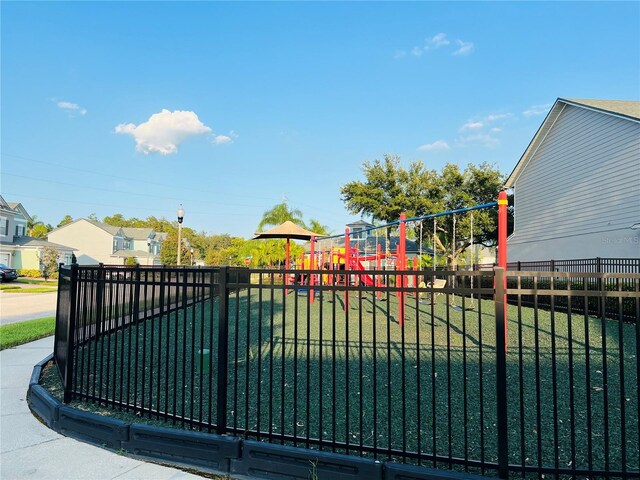 exterior space featuring a playground and a lawn