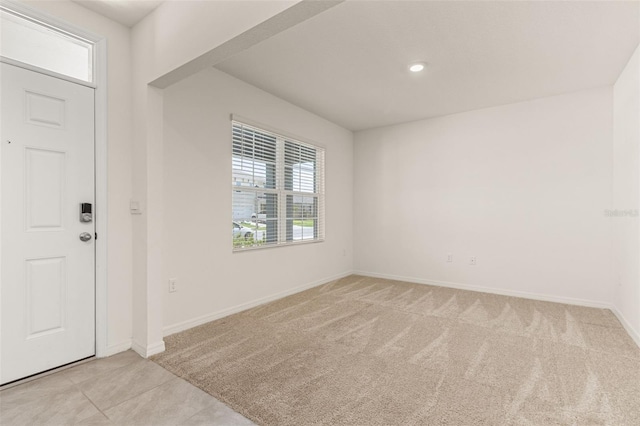 entryway featuring light carpet