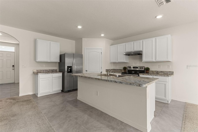 kitchen with stainless steel appliances, white cabinets, sink, and a kitchen island with sink