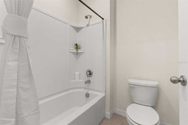 bathroom featuring tile patterned flooring, toilet, and shower / bath combination with curtain