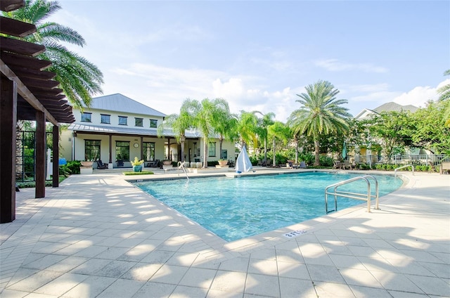 view of swimming pool with a patio