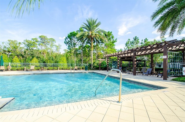 view of swimming pool with a pergola and a patio area