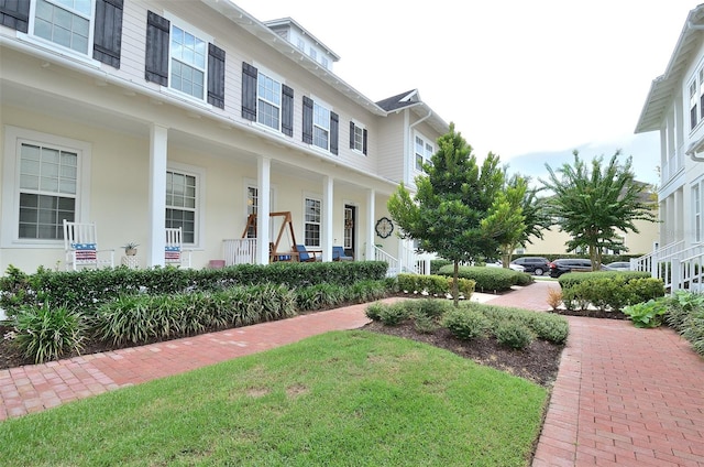 view of front of property featuring covered porch