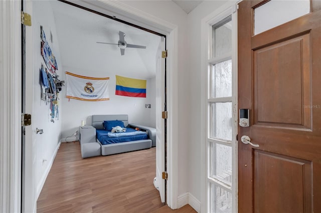 foyer entrance featuring ceiling fan and light hardwood / wood-style flooring