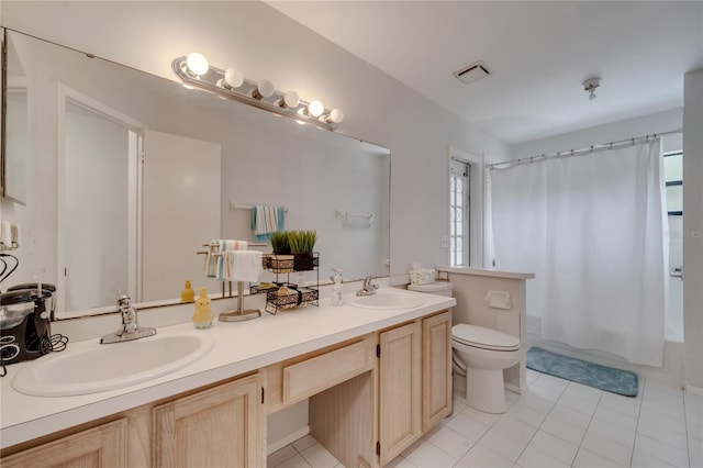 full bathroom with a wealth of natural light, vanity, toilet, and shower / bath combo