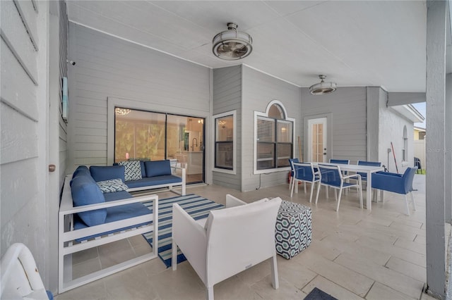 view of patio / terrace with an outdoor living space and ceiling fan