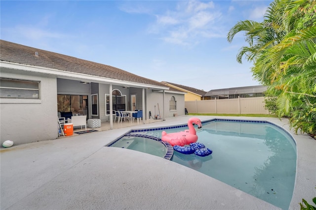 view of pool with a patio and ceiling fan