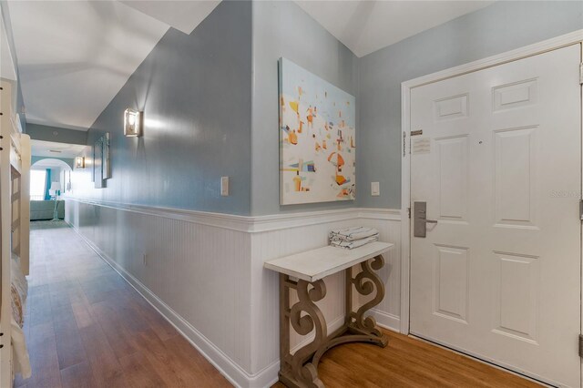 corridor with hardwood / wood-style floors