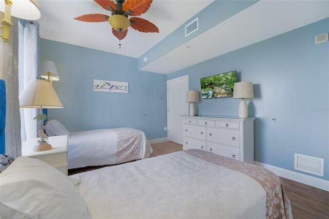 bedroom with hardwood / wood-style floors and ceiling fan