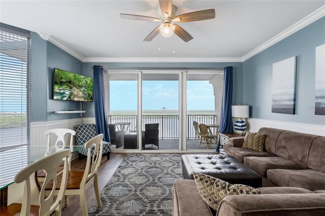 living room with ceiling fan, crown molding, and hardwood / wood-style floors