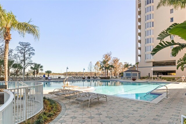 view of swimming pool featuring a patio area