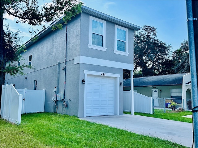 view of home's exterior with a garage and a lawn