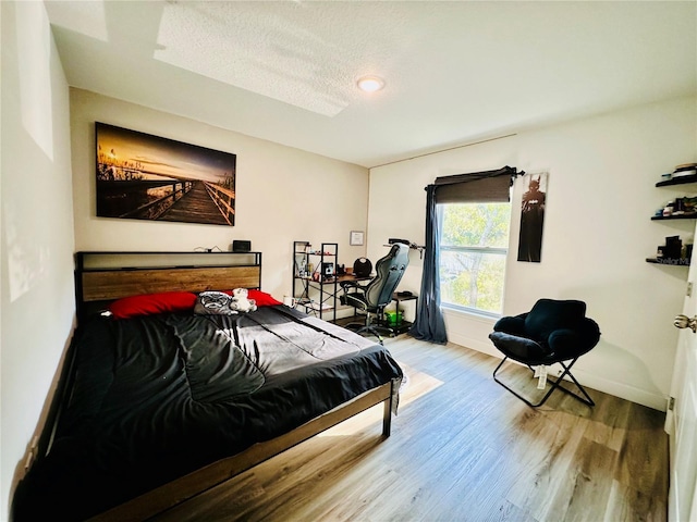 bedroom with wood-type flooring