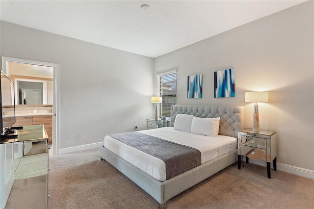 bedroom with carpet and ensuite bathroom