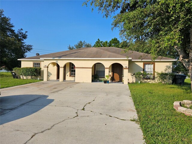 ranch-style home with a front lawn