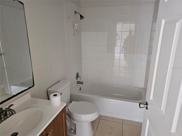 full bathroom with toilet, tiled shower / bath combo, tile patterned flooring, and vanity