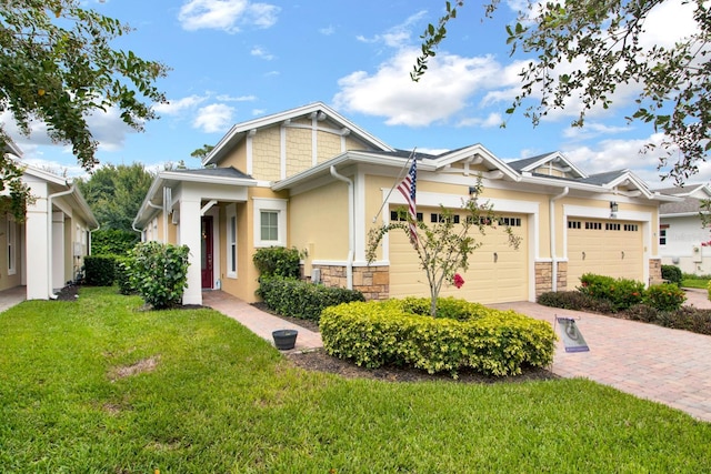 craftsman-style home with a front yard and a garage