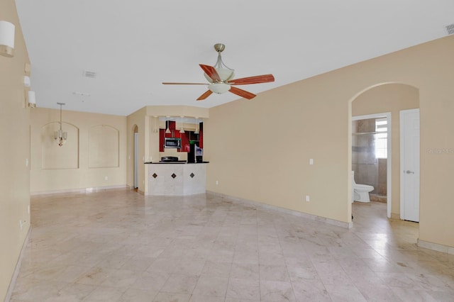 unfurnished living room featuring ceiling fan