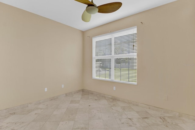 unfurnished room with ceiling fan